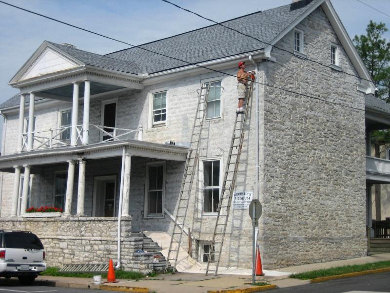 Painter Garry Orebaugh, Jr. works on restoring the facade of the Marshall House